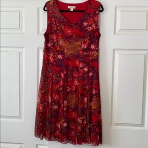 Red sleeveless flowering dress.
